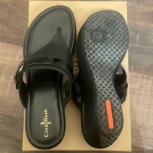 Black Cole Haan flip flops size 11